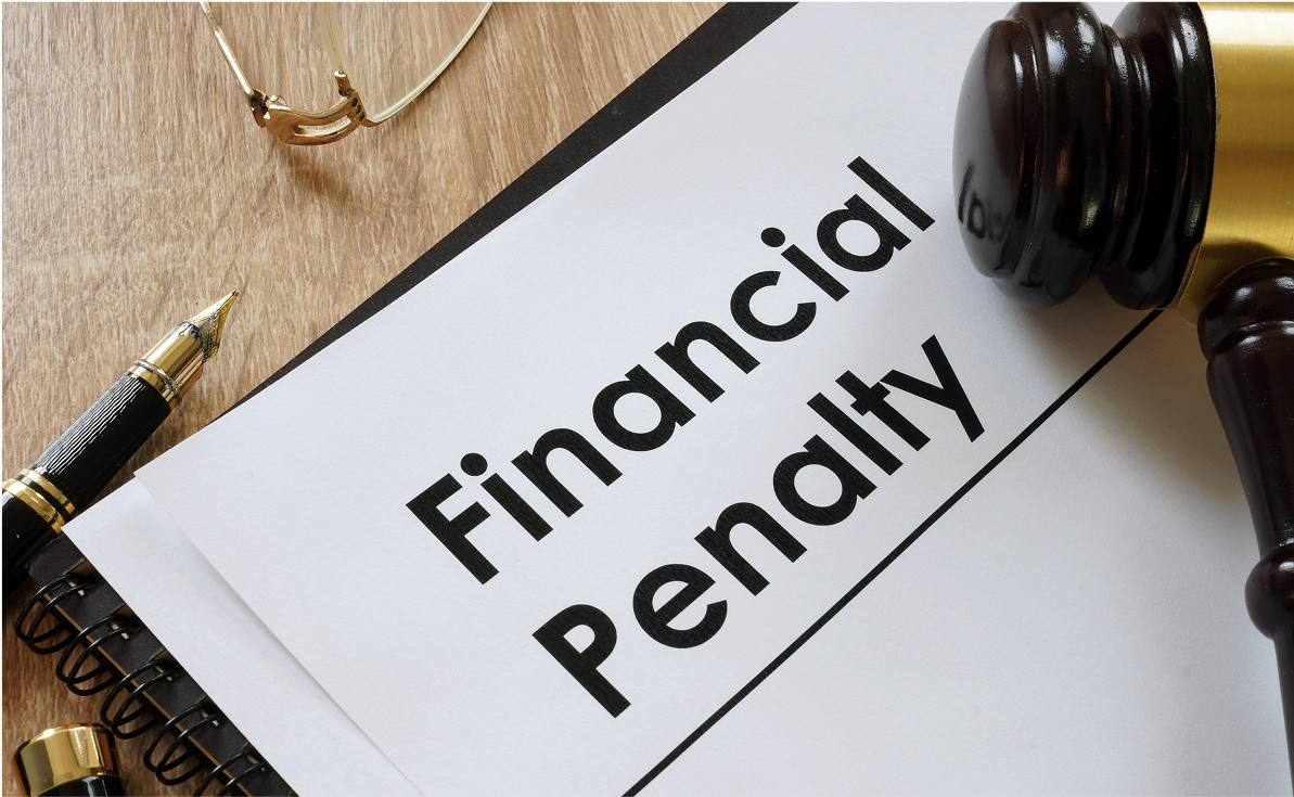 Financial penalty document with gavel and glasses.